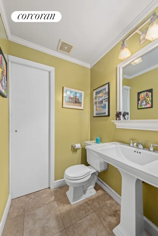 New York City Real Estate | View 243 East 77th Street, 2B | Half Bath and Laundry Room | View 9