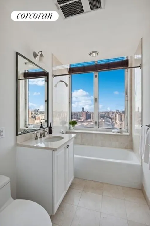 New York City Real Estate | View 455 Central Park West, 23A | Bathroom with Western City Views | View 12
