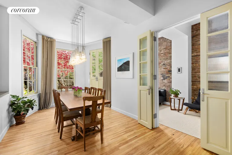 New York City Real Estate | View 326 West 22ND Street, GARDENDUPL | Dining/Living Area with Bay Windows | View 9