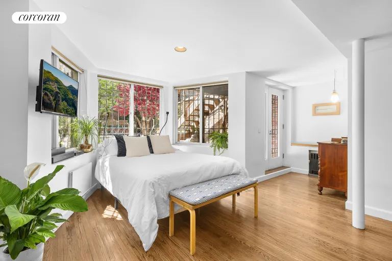 New York City Real Estate | View 326 West 22ND Street, GARDENDUPL | Bay Windows to Garden in Suite | View 13