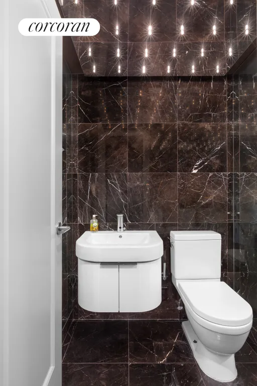 New York City Real Estate | View 160 Central Park South, 410 | Half Bathroom | View 7