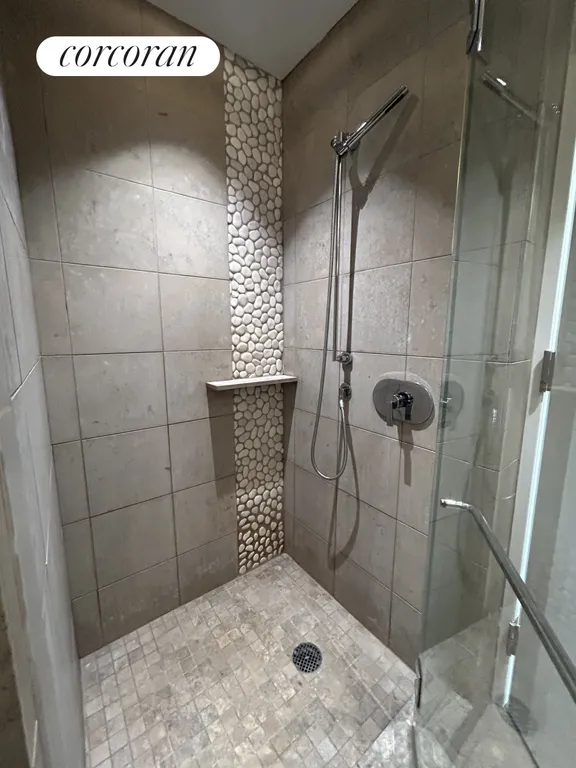 New York City Real Estate | View 247 West 46th Street, 2303 | Shower in primary bath | View 5