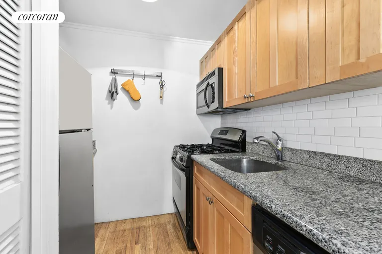 New York City Real Estate | View 407 East 12th Street, 2FW | Galley Kitchen with washer/dryer | View 7