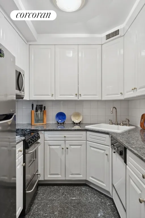 New York City Real Estate | View 30 West 60th Street, 5E | Half Bathroom | View 3