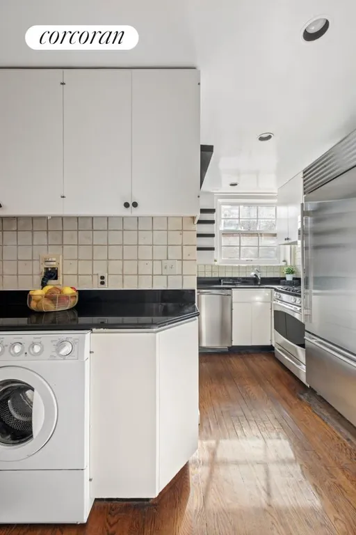 New York City Real Estate | View 222 East 71st Street, 6A | Laundry Area in Kitchen | View 6