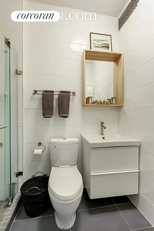 New York City Real Estate | View 56 Jane Street, 1B | Bathroom with tiled shower! | View 4