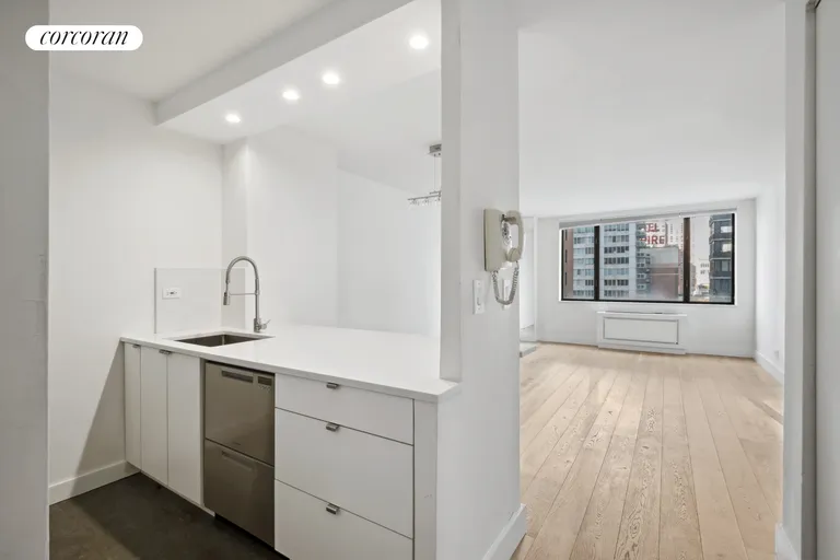 New York City Real Estate | View 30 West 61st Street, 11E | Open kitchen into living room | View 5