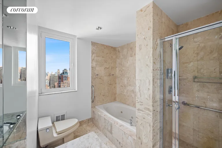 New York City Real Estate | View 100 United Nations Plaza, 35E | Windowed marble bathroom | View 7