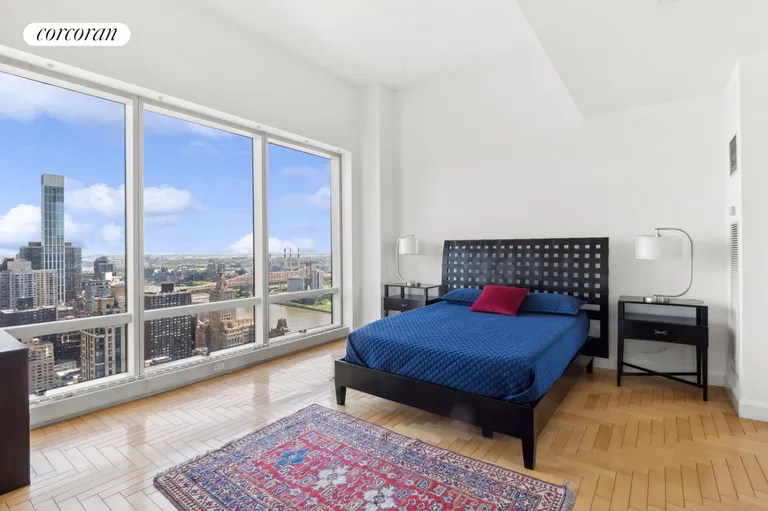 New York City Real Estate | View 845 United Nations Plaza, 49E | Lofty main bedroom | View 12