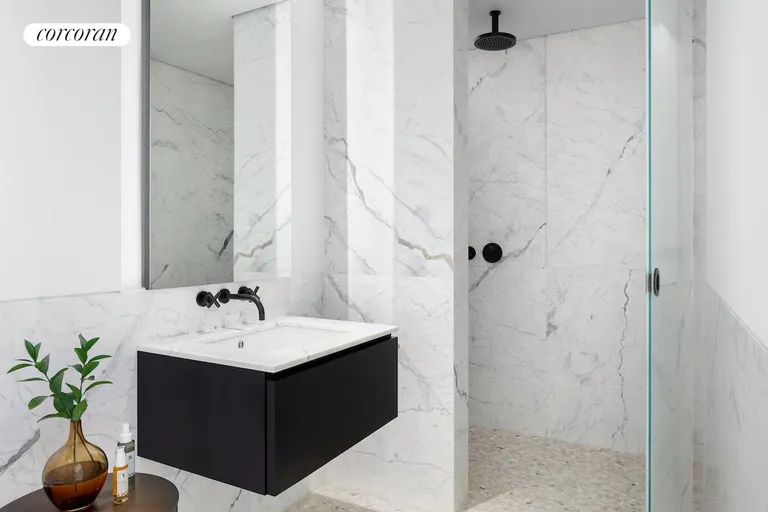 New York City Real Estate | View 16 West 40th Street, 25A | Marble-clad Secondary Bath | View 9