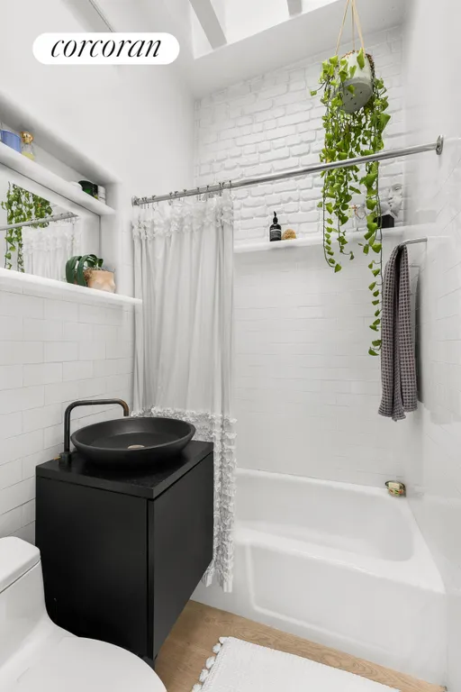 New York City Real Estate | View 326 West 22ND Street, 4R | Bathroom with Skylight | View 5