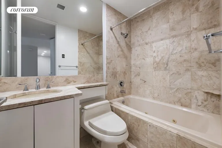 New York City Real Estate | View 100 United Nations Plaza, 7D | Marble bathroom | View 4