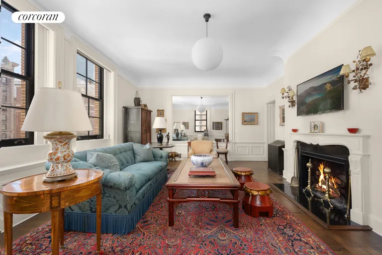 New York City Real Estate | View 32 East 64th Street, 7NE | Corner Living Room with WBFP | View 6