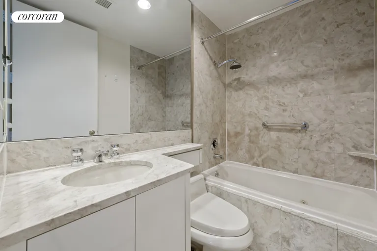 New York City Real Estate | View 100 United Nations Plaza, 15F | Marble bathroom | View 5