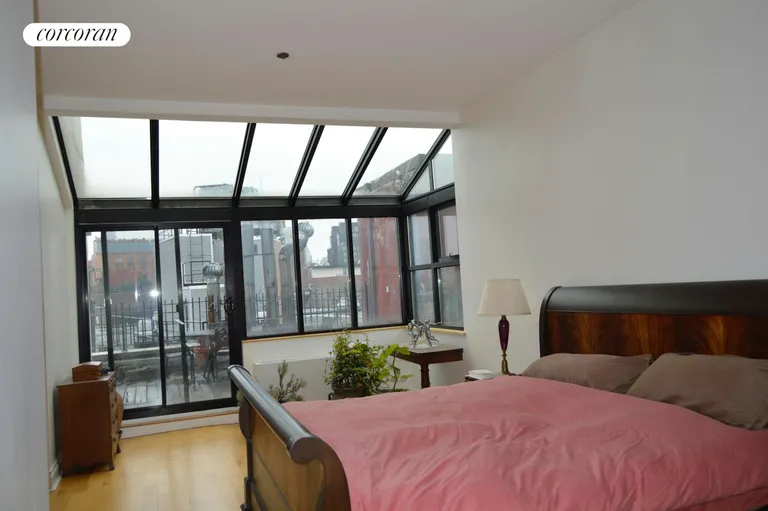New York City Real Estate | View 35 Bethune Street, PHD | Primary Bedroom and Terrace | View 4