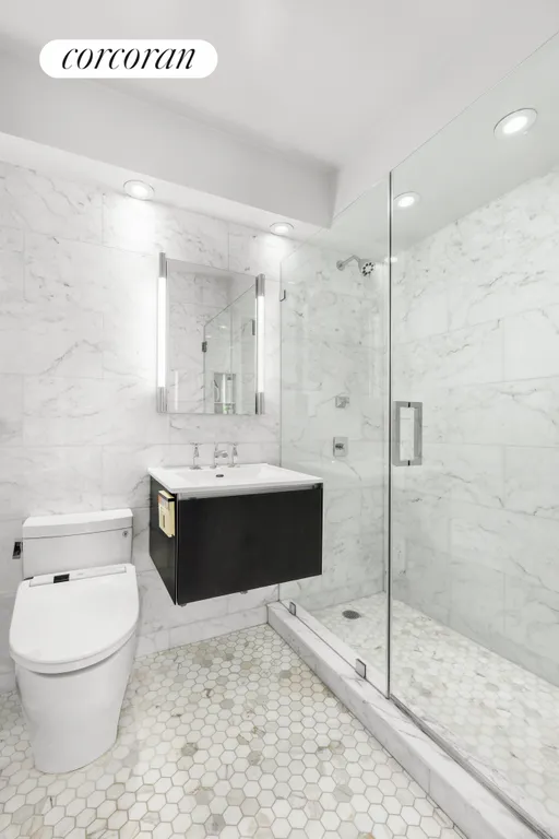 New York City Real Estate | View 63 East 9th Street, 14K | Primary Bath with Shower | View 7