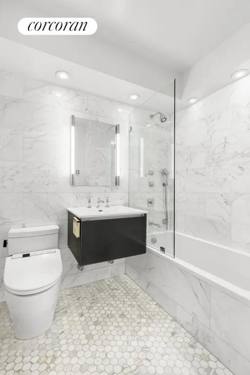 New York City Real Estate | View 63 East 9th Street, 14K | Second Bath with Soaking Tub | View 9