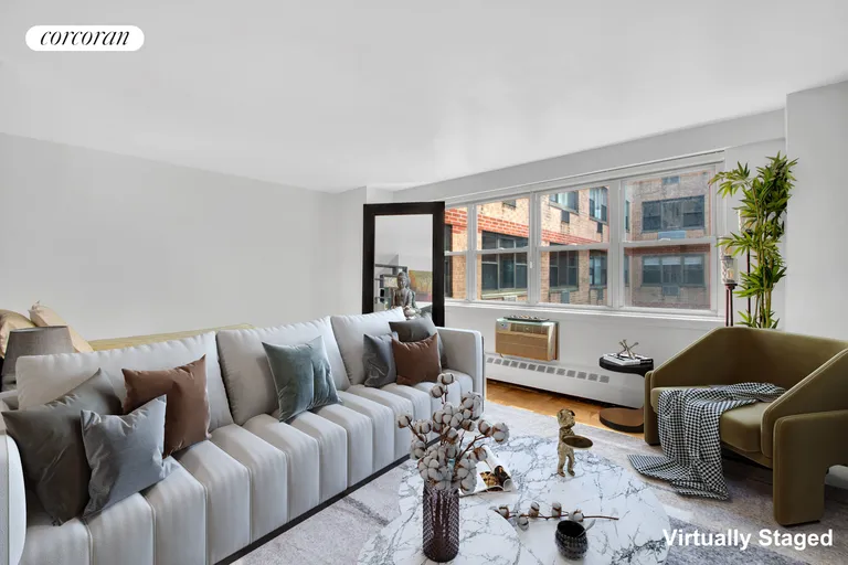 New York City Real Estate | View 340 East 80th Street, 18A | Sofa with bed behind it | View 2