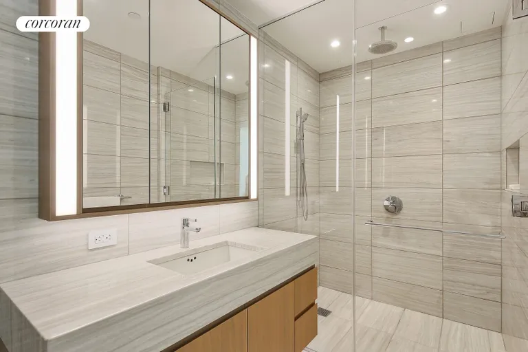New York City Real Estate | View 50 West Street, 10B | Marble Bathroom | View 7