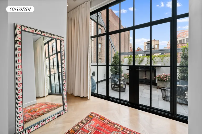 New York City Real Estate | View 23 Cornelia Street | Primary bedroom with terrace | View 11