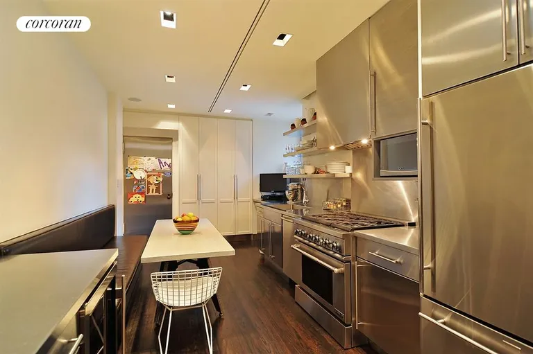 New York City Real Estate | View 40 East 83rd Street, 6S | Windowed Stainless Steel Chef's Kitchen | View 7