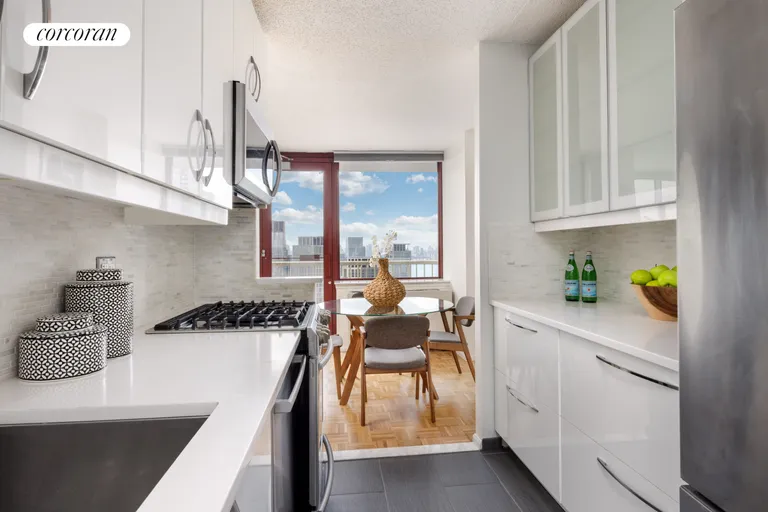 New York City Real Estate | View 4-74 48th Avenue, 38K | Sleek Kitchen w/Stainless Steel App | View 6