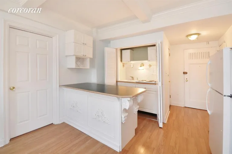 New York City Real Estate | View 5 Tudor City Place, 831 | Kitchen with detailed breakfast bar and new stove | View 2