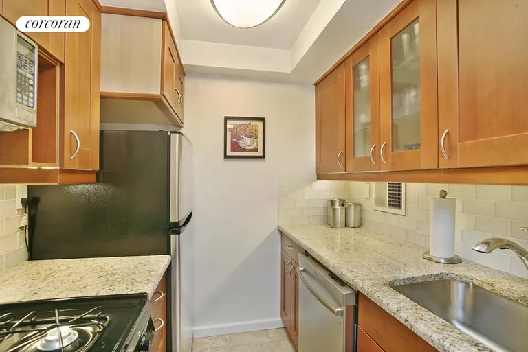 New York City Real Estate | View 225 East 57th Street, 10R | Beautifully Renovated Kitchen | View 2