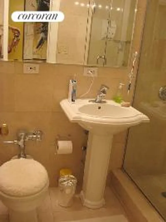 New York City Real Estate | View 2 Tudor City Place, 5JS | Marble Bathroom | View 2