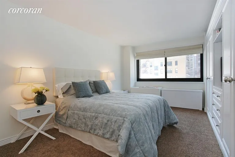 New York City Real Estate | View 1725 York Avenue, 6H | Master Bedroom with beautiful built-ins | View 4