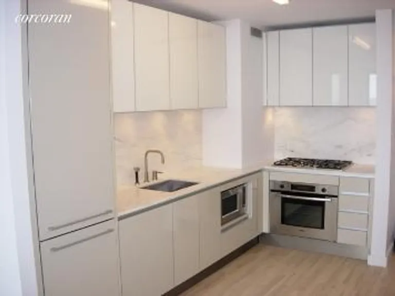 New York City Real Estate | View 322 West 57th Street, 53U | Designer Kitchen | View 3