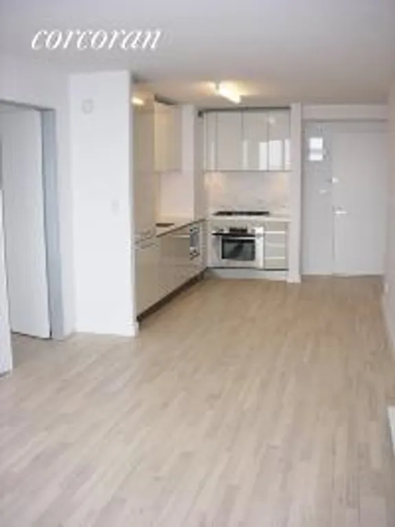 New York City Real Estate | View 322 West 57th Street, 53U | Open Kitchen and Dining Area | View 4