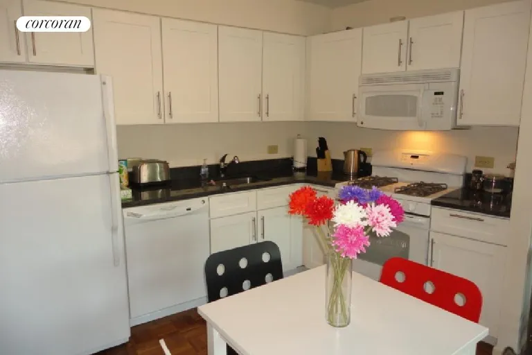 New York City Real Estate | View 218 Myrtle Avenue, 2A | Open Kitchen, stone counter, microwave, dishwasher | View 3