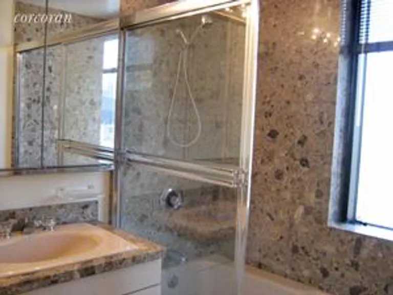 New York City Real Estate | View 721 Fifth Avenue, 30F | Marble Bathroom | View 3