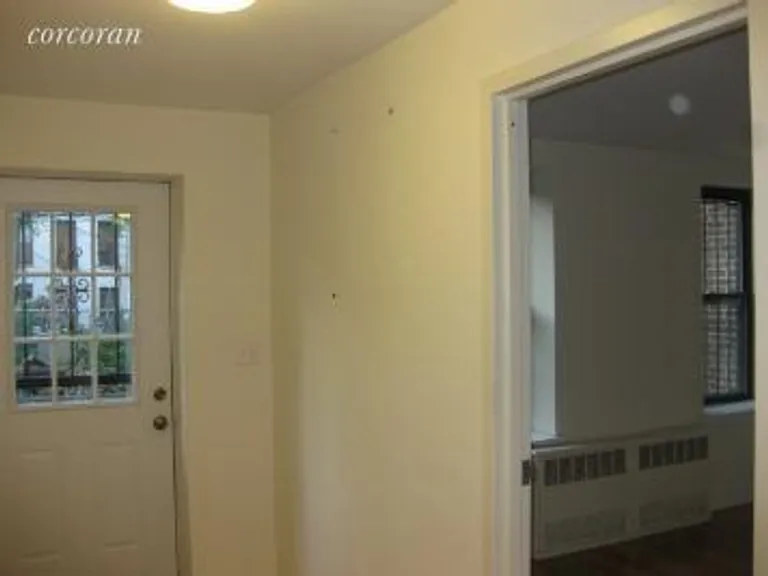 New York City Real Estate | View 191 Putnam Avenue, 1 | Foyer leading to yard | View 11