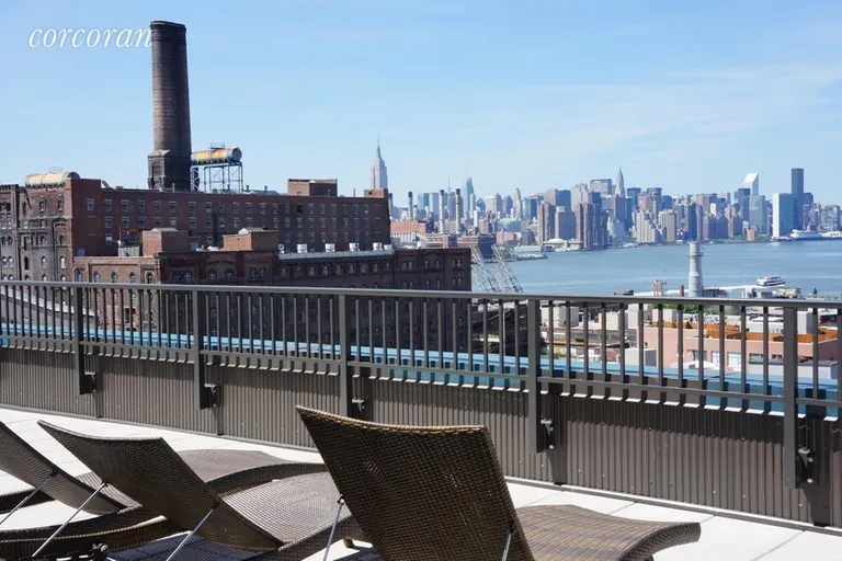 New York City Real Estate | View 390 Wythe Avenue, 7B | Common roof deck with Manhattan views | View 9