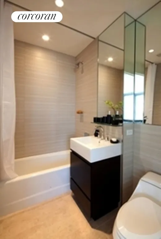 New York City Real Estate | View 105 West 29th Street, 37G | New designer bathroom | View 7