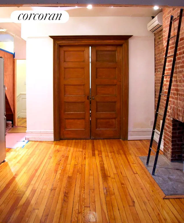 New York City Real Estate | View 668 Park Place, 3B | Living area and door to bedroom | View 4