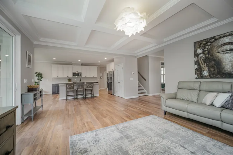 New York City Real Estate | View 3424 Saint Clair Court NW | family room to kitchen | View 12