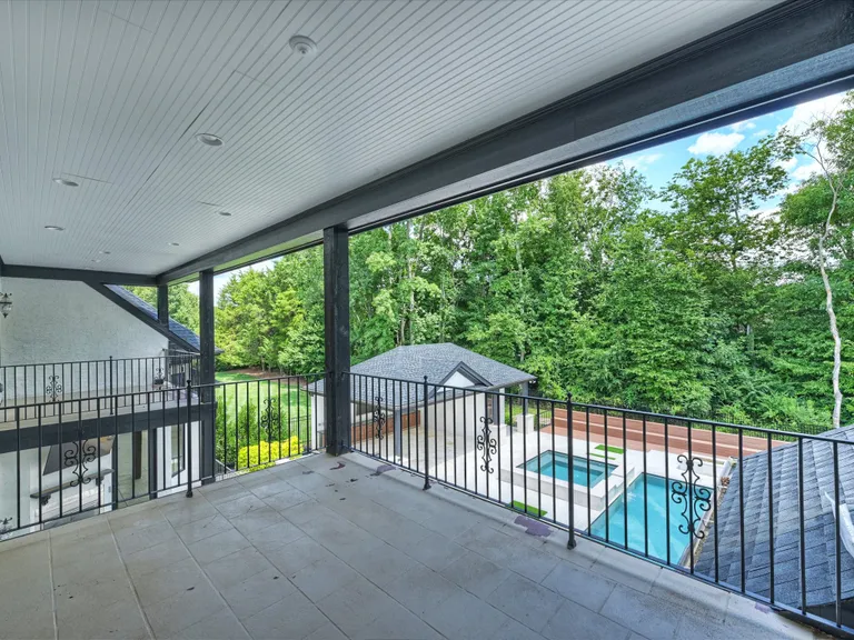 New York City Real Estate | View 2013 Connonade Drive | Covered Porch off Bedroom | View 29