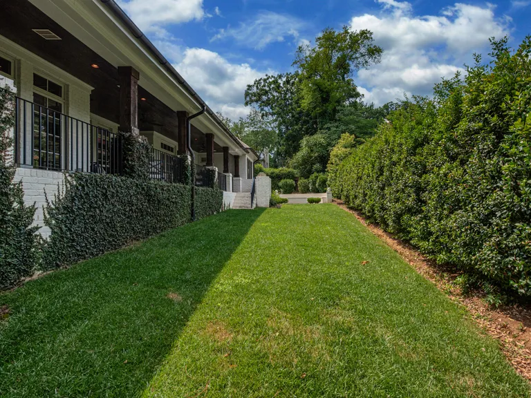 New York City Real Estate | View 2043 Sharon Lane | View of the covered porch from the private back yard | View 33