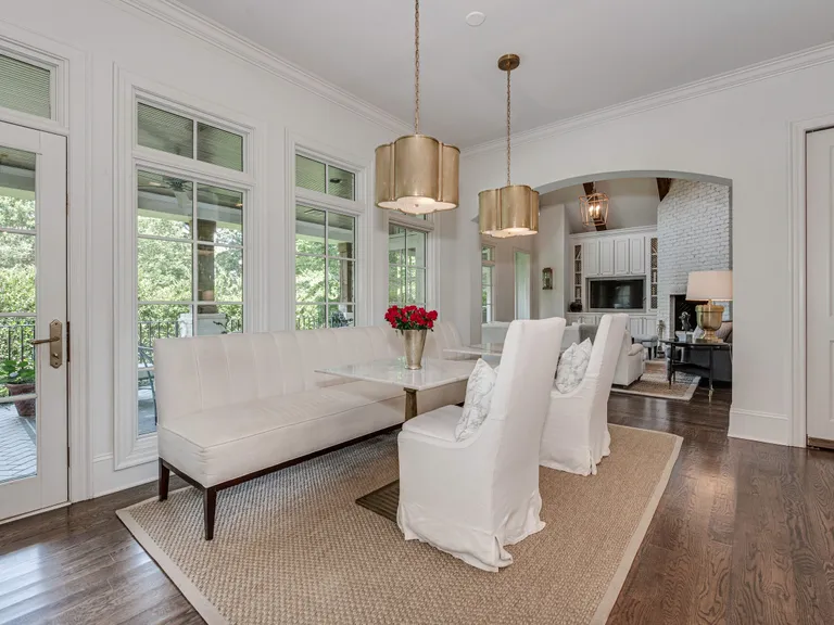 New York City Real Estate | View 2043 Sharon Lane | Lovely breakfast area is flooded with light from a wall of windows to the covered porch | View 13