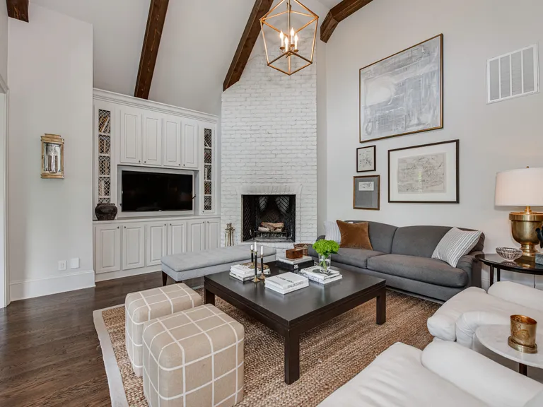 New York City Real Estate | View 2043 Sharon Lane | Two-story vaulted keeping room boasts a wood-burning fireplace with gas starter and built-in entertainment area | View 14