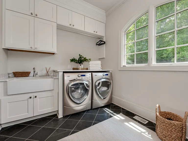 New York City Real Estate | View 2043 Sharon Lane | Main level laundry room with farm sink, marble countertops and loads of storage | View 11