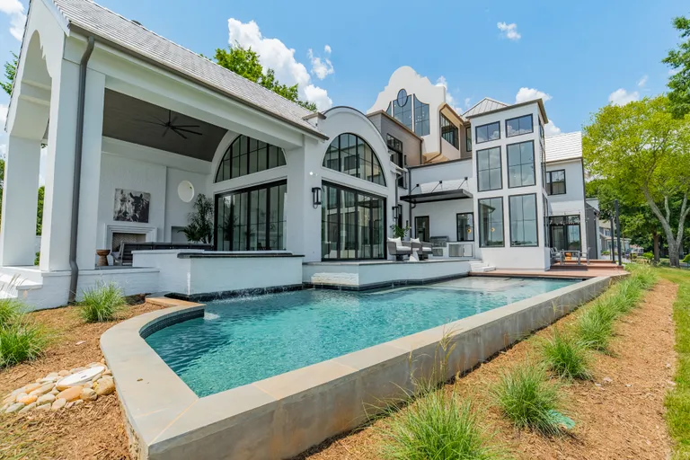 Charlotte Real Estate | View 18000 Whispering Oaks Drive | Side Elevation | View 10